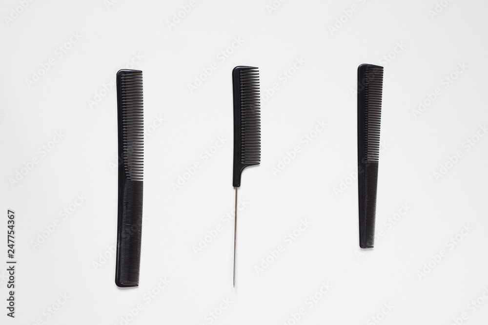 flat lay set of salon hairdressing black combs in order isolated on white background flat lay set of salon hairdressing black combs in order isolated on white background
