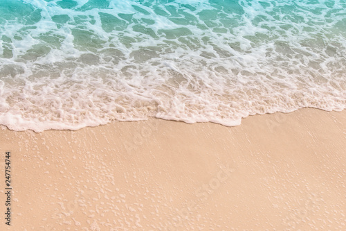 Ocean wave on the sandy shore