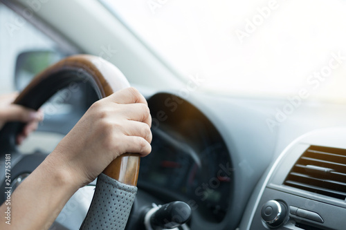 woman hand holding control steering wheel driving car road trips travel in the morning day © sutichak