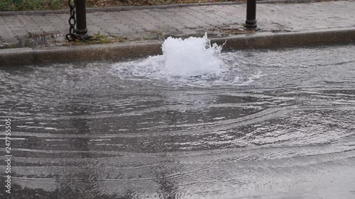 Footage of water comming out from a road drainage due to a ruptured water pipe under the ground...