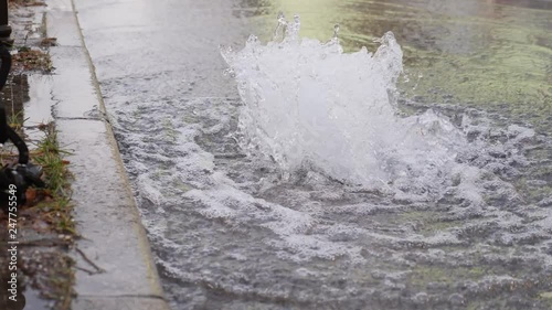 Footage of water comming out from a road drainage due to a ruptured water pipe under the ground...