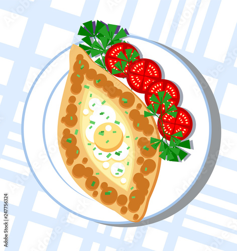 Khachapuri - tortilla with cheese, on a plate surrounded by greens and slices of tomatoes