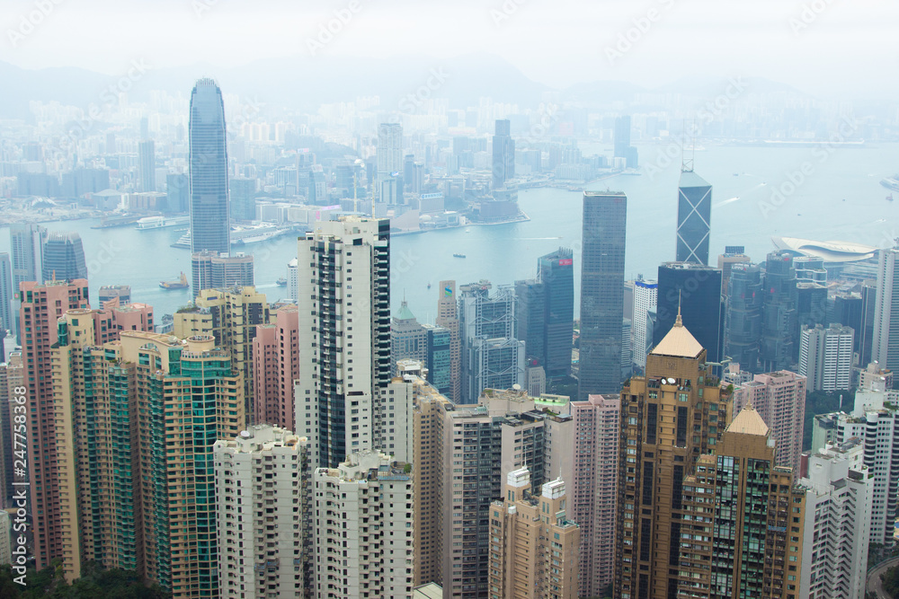 Panorama Hong Kong city view from Victoria peak. Business building and skyscrapers in Hong Kong city in Victoria harbour, China. Aerial view