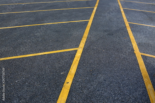 yellow line marking on black asphalt road