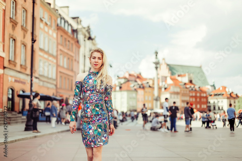 Street stylsh portrait of young blodnie cheerful girl walking in the old town. Vacation, travelling, beauty concept © Andreshkova Nastya