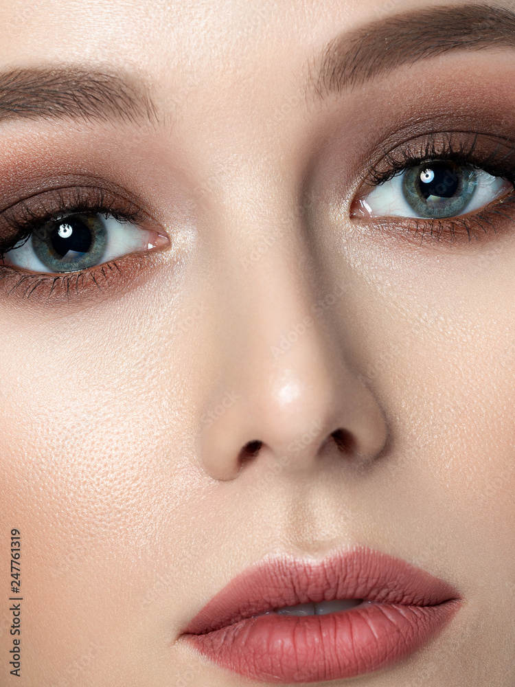 Close up beauty portrait of young woman with beautiful fashion makeup.  Brown smokey eyes. Studio shot. Extreme closeup, partial face view Stock  Photo | Adobe Stock