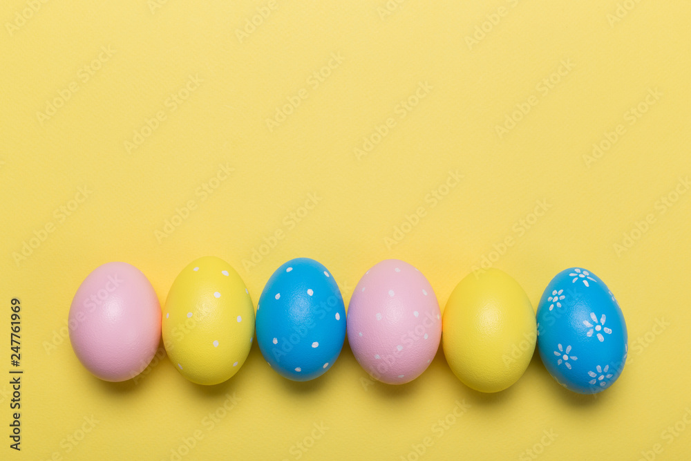 easter eggs on yellow pastel color background with space. Concept