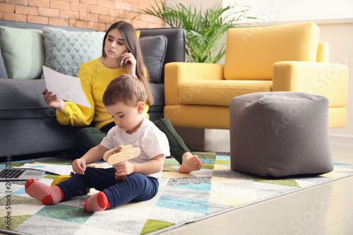 Cute little boy playing whi...