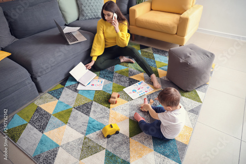 Cute little boy playing whi...
