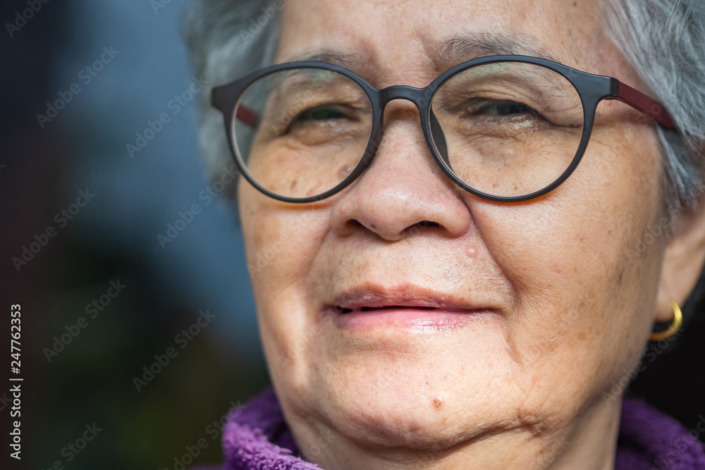 Close-up of face elderly woman smile and wearing eyeglasses. Close-up of face elderly woman smile and wearing eyeglasses.