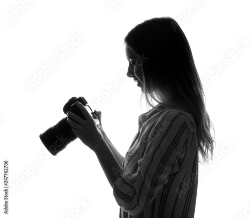 Silhouette of beautiful photographer on white background