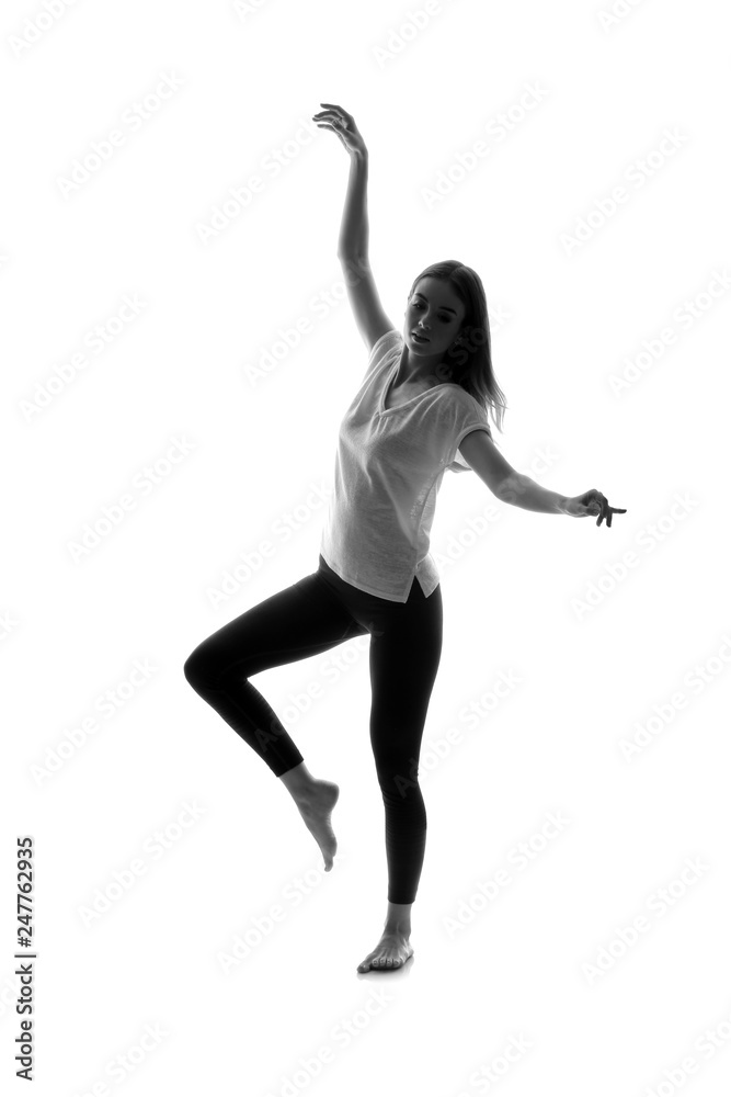 Portrait of beautiful dancing woman on white background