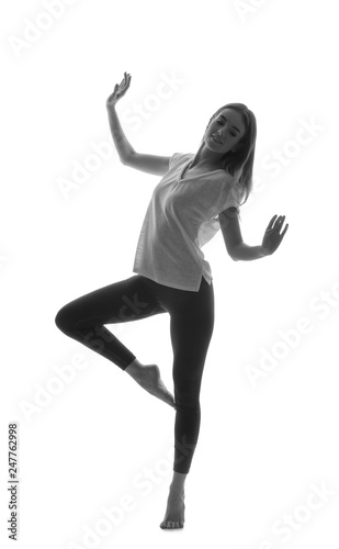 Portrait of beautiful dancing woman on white background
