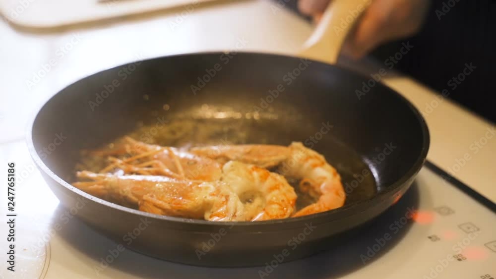 Fresh prawns with chilli and garlic on the grill Fresh prawns with chilli and garlic on the grill