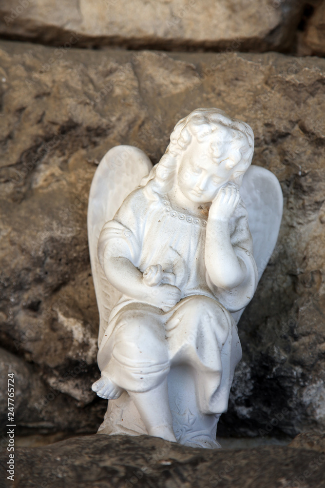 A white mourning porcelain angel at Mirogoj cemetery, Zagreb, Croatia A white mourning porcelain angel at Mirogoj cemetery, Zagreb, Croatia