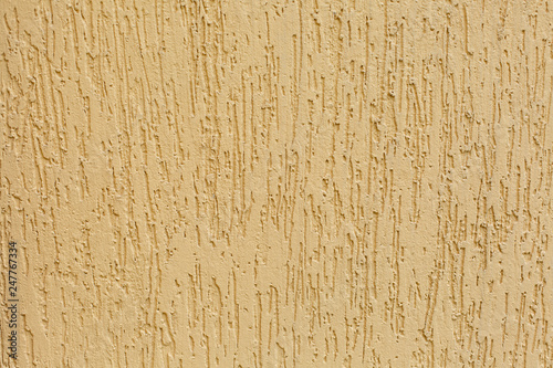 Texture of yellow concrete wall. Beautiful yellow cement wall background for design and copy space.