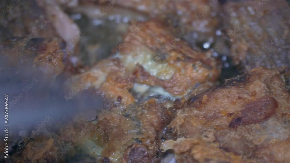 Delicious fish is fried in a pan macro Delicious fish is fried in a pan macro