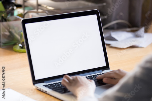 Close up of worker typing mail on laptop