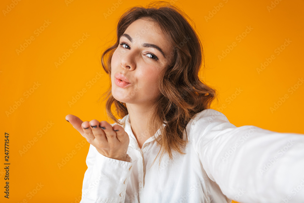 Cheerful young woman casualy dressed standing Cheerful young woman casualy dressed standing