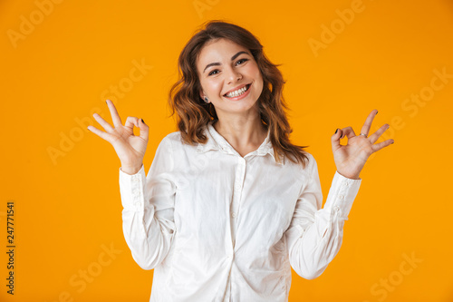 Cheerful young woman casualy dressed standing photo