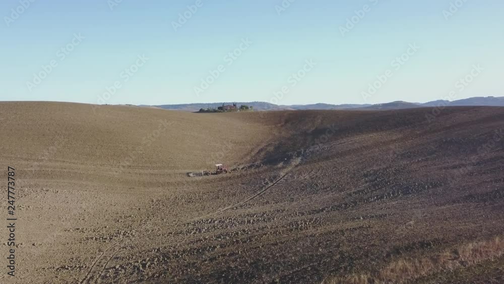 Corn Field Aerial. Tractor working in the field Corn Field Aerial. Tractor working in the field