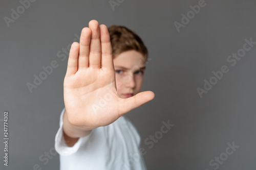 Obraz na płótnie Boy showing stop gesture with his hand