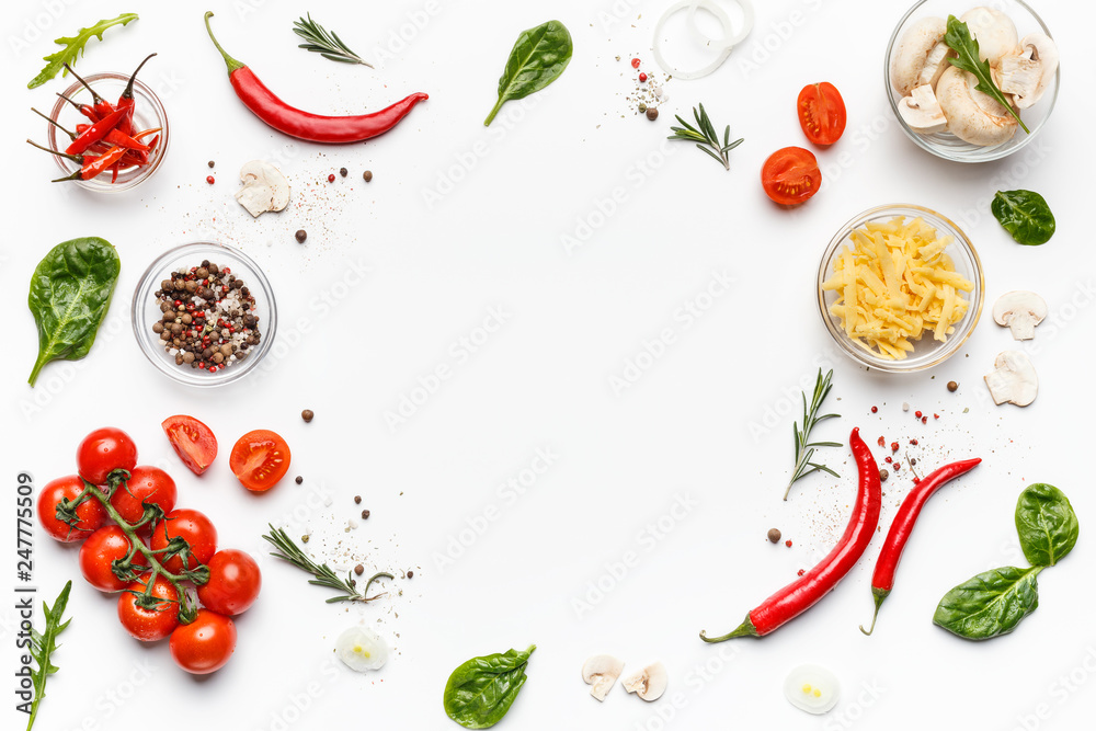 Colorful pizza ingredients on white background, top view