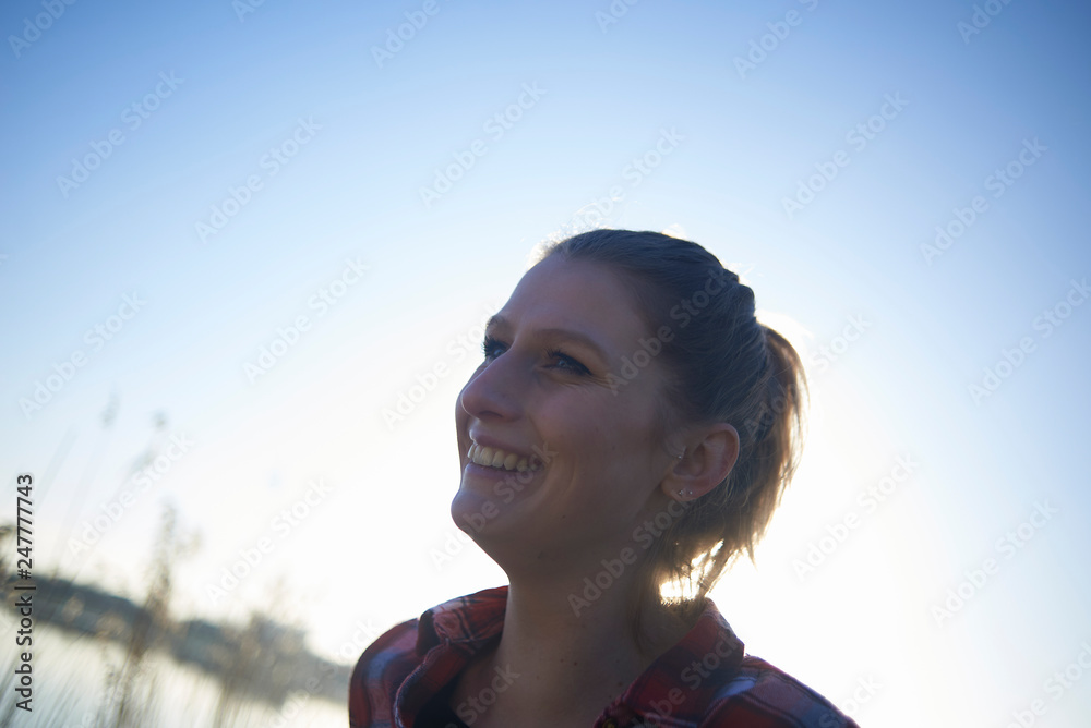 Portraits of a young lesbian couple enjoying their time together around a lake and jetty in winter sunshine Portraits of a young lesbian couple enjoying their time together around a lake and jetty in winter sunshine