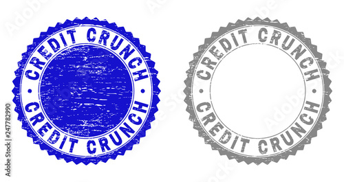 Grunge CREDIT CRUNCH stamp seals isolated on a white background. Rosette seals with grunge texture in blue and grey colors. Vector rubber stamp imitation of CREDIT CRUNCH label inside round rosette.