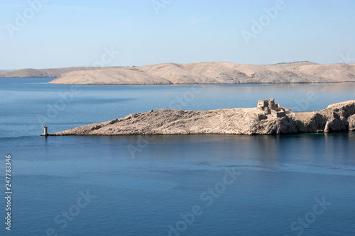 Lighthouse and the ruins of the far south point of the island Pag in Croatia