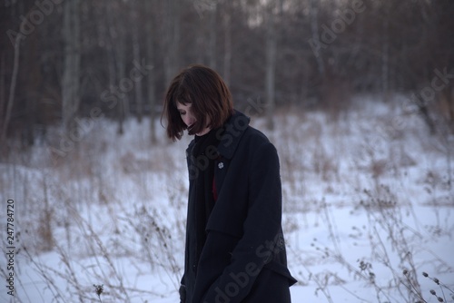 portrait of young woman in winter forest