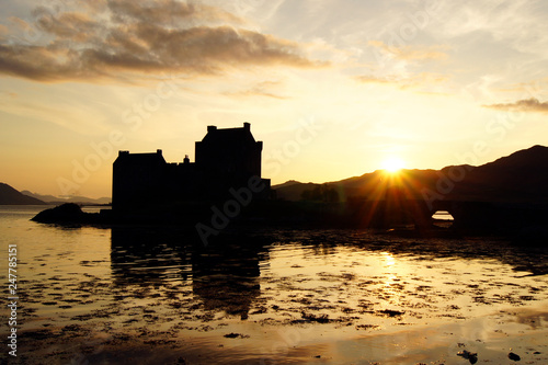 Eilean Donan Castle at sunset with some reflections in the water