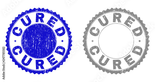 Grunge CURED stamp seals isolated on a white background. Rosette seals with grunge texture in blue and grey colors. Vector rubber stamp imitation of CURED label inside round rosette.