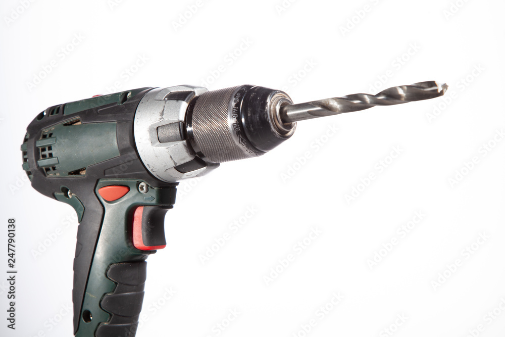 Cordless drilling tool on a close-up background. Cordless drilling tool on a close-up background.