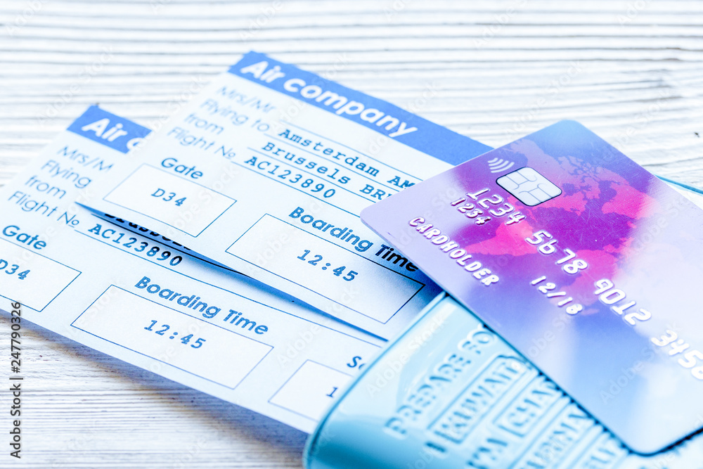 travel concept with passport, credit cards and flight tickets on light table travel concept with passport, credit cards and flight tickets on light table
