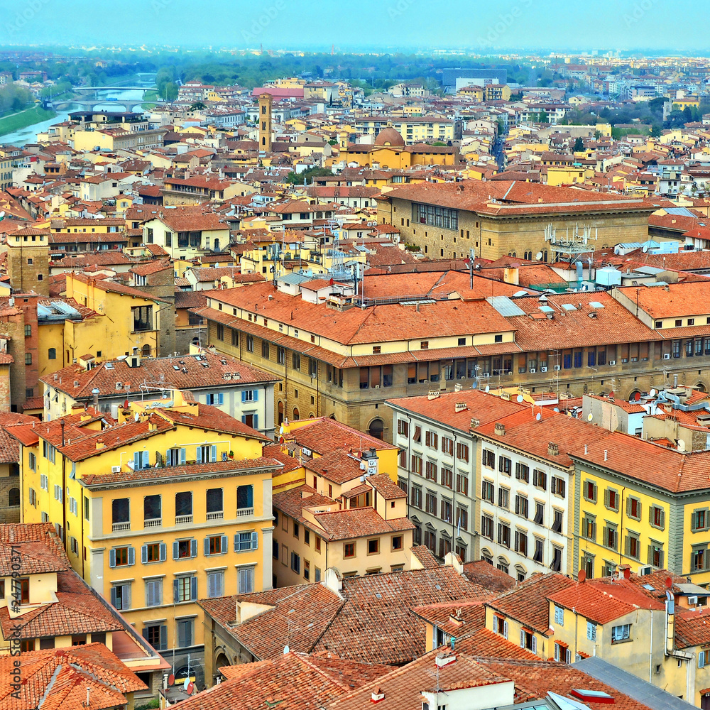 Aerial view. Nice buildings with red tile roofs in the old city. Italian culture and architecture. Urban landscape. Italy, Florence