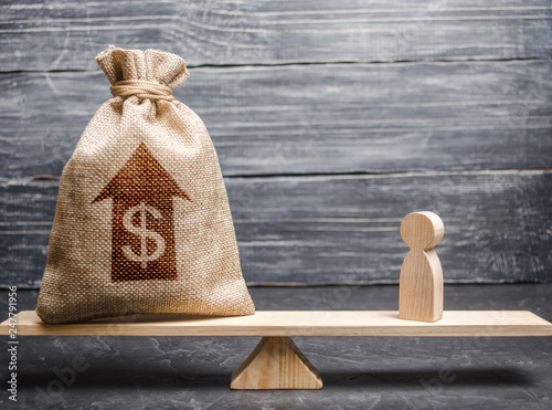 Принти на полотні Money bag with up arrow and man figurine on scales