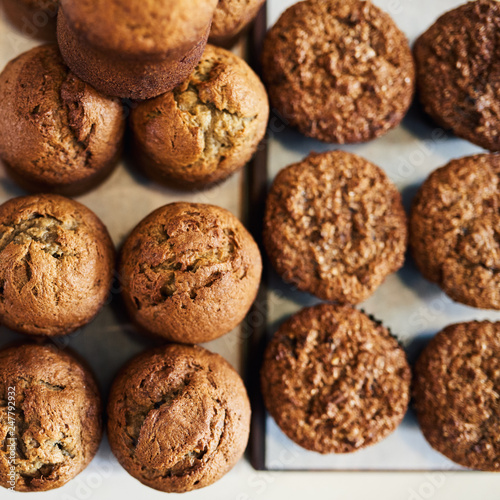 Delicious assortment of muffins sitting on cafe serving boards