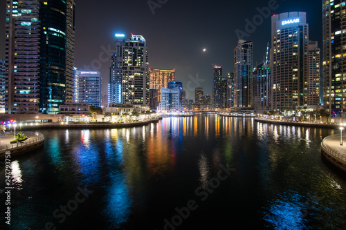 Dubai, United Arab Emirates - October, 2018: Colorful city lights at night time in Dubai Marina, United Arab Emirates
