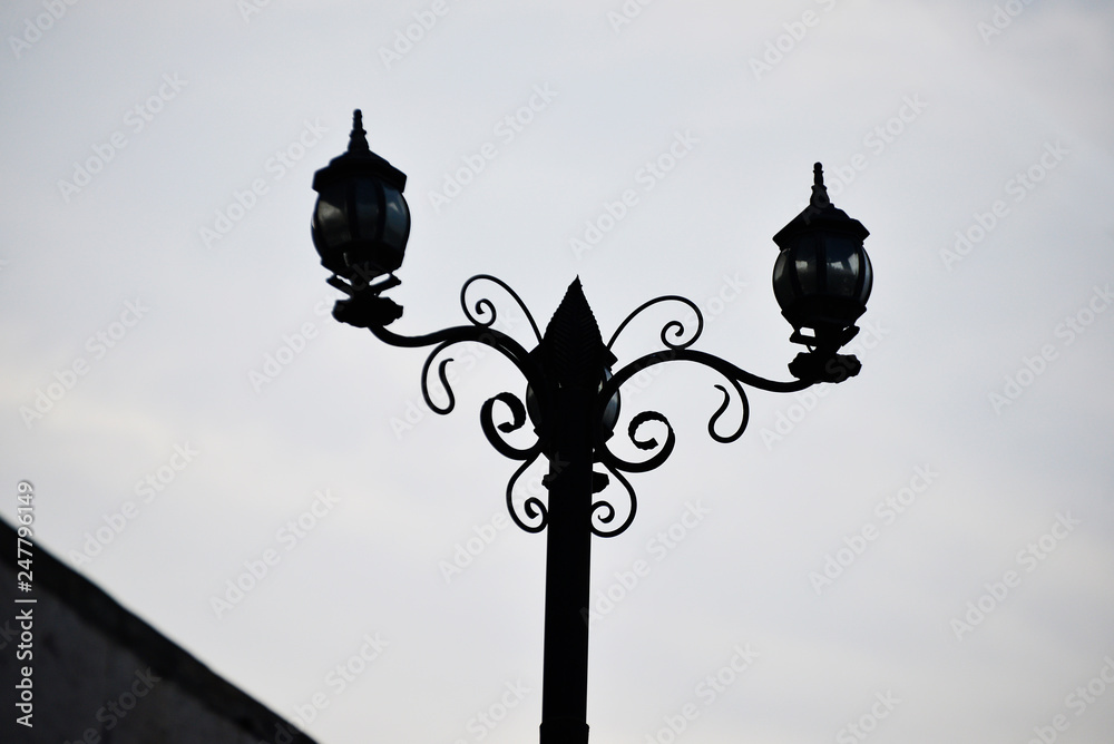 old street lamp on a sky background