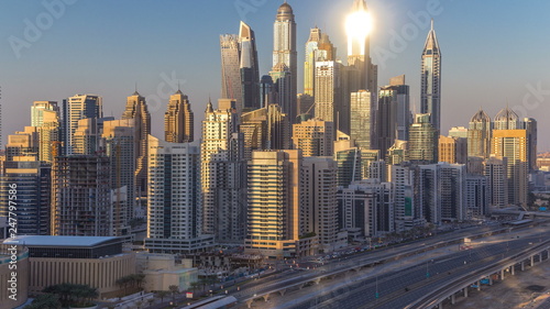 Dubai Marina towers during sunset aerial timelapse, United Arab Emirates © neiezhmakov