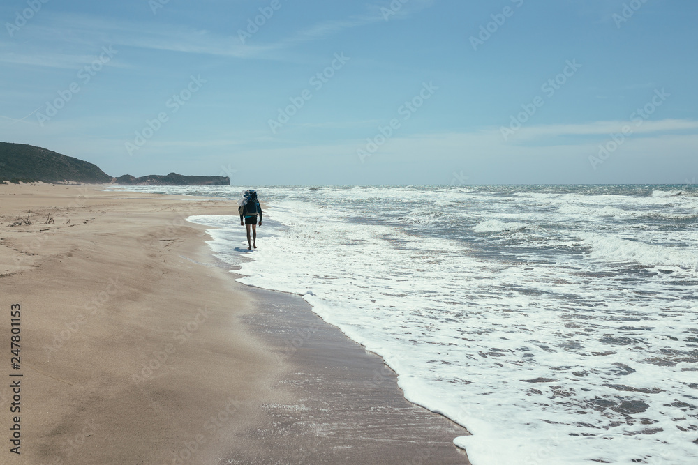 tourist  walking on the beach