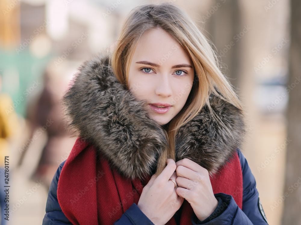 Portrait of young woman at sunny winter day. Portrait of young woman at sunny winter day.
