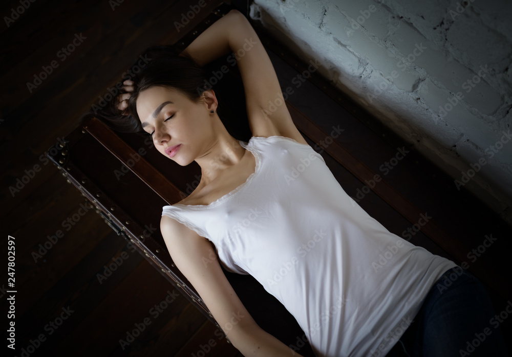 Obraz premium Portrait of a beautiful young brunette. Selective soft focus.