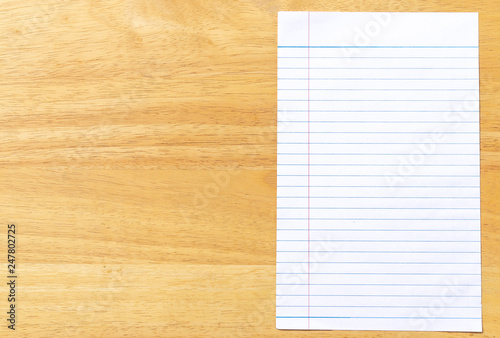 Notebook Lined Paper on wood desk Background