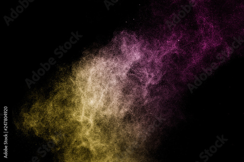 gold and purple powder effect splash for makeup artist or graphic design in black background