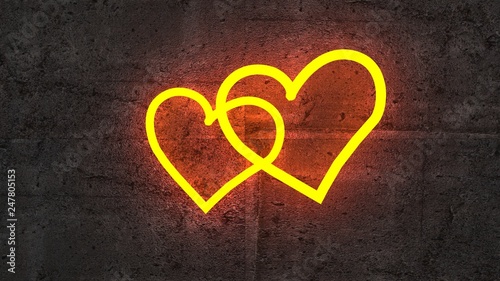 two shining golden heart on rough concrete wall
