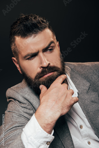 pensive beard businessman isolated on brown