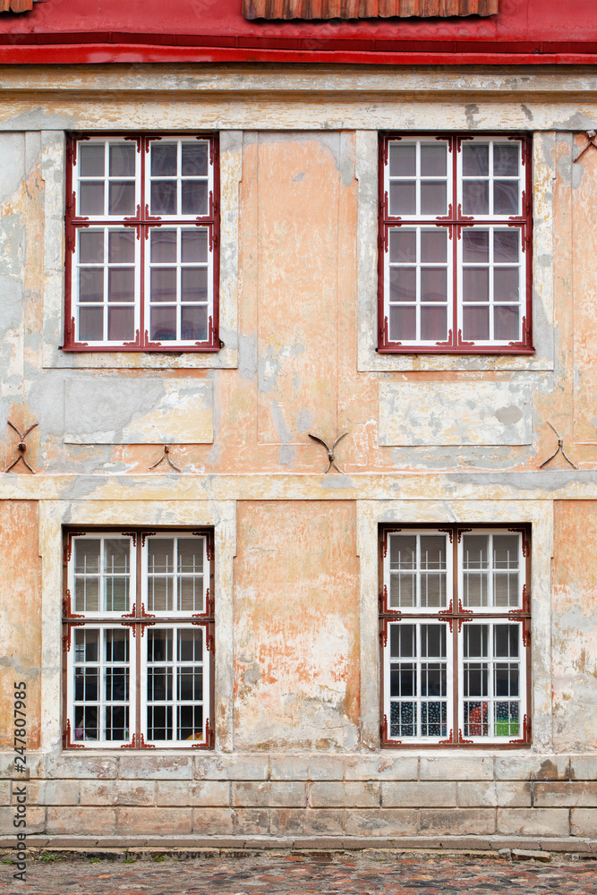 Original background. Fragment of an old building. Facade requiring repair