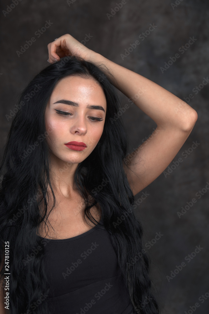 Young beautiful girl on a dark background Young beautiful girl on a dark background